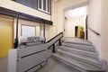 Entrance of an old house with a gray granite staircase and a ramp for stairs for the disabled Royalty Free Stock Photo