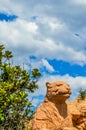 Entrance of The Palace / Lost City /Sun City with stone statues under blue and cloudy sky