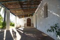 Entrance with palm tree of abadoned church Ermita de Sant Antoni y Sant Jaume in Cap Blanche, Altea, Spain