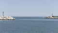 The entrance of Pesaro harbour with tetrapod breakwaters, and a green and a red lighthouse on the piers Italy, Europe Royalty Free Stock Photo