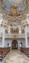 Feb 1, 2020 - Steingaden, Germany: Entrance of pilgrimage church of wies Wieskirche with pipe organ rococo style dome Royalty Free Stock Photo