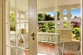 Entrance porch with wicker chair and glass door Royalty Free Stock Photo