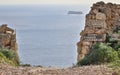 Entrance with private and no entrance Eingang Verboten lettering on Dingli Cliffs with the Maltese Island Filfla in the