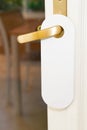 Entrance room with white door hanger of hotel with empty sign please do not disturb Royalty Free Stock Photo