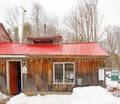 Massachusetts maple sugarhouse during boiling season in Winter snow