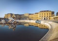 Entrance of Schonbrunn Palace at sunrise with fountain reflection