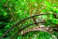 Entrance sign hanging over open garden gate