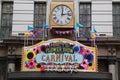 Entrance sign at the Macy`s Herald Square during `Carnival` theme flower decoration during famous Macy`s Annual Flower Show