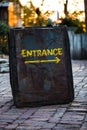 Entrance sign made out of rusty metal sheet