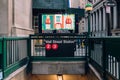Entrance and stairs down to Wall Street subway station in New York, USA