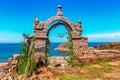 Entrance stone arch leading to the interior of Taquile Island in Lake Titicaca