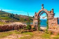 Entrance stone arch leading to the interior of Taquile Island in Lake Titicaca