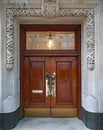 Entrance with stone frame and wooden double door