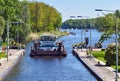 Entrance of a thrust boat into a historic lock on the waterway `Teltowkanal` near Berlin
