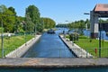 Entrance of a thrust boat into a historic lock on the waterway `Teltowkanal` near Berlin