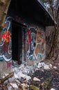 Entrance to abandoned concrete bunker built during the Second World War right in a hill near the center of Vilnius. Walls painted