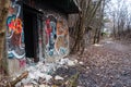 Entrance to abandoned concrete bunker built during the Second World War right in a hill near the center of Vilnius. Walls painted