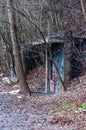 Entrance to abandoned concrete bunker built during the Second World War right in a hill near the center of Vilnius. Walls painted