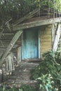 Entrance to abandoned ruined scary old wooden house Royalty Free Stock Photo