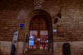 a tall wooden door in a stone building. Pamplona, Spain