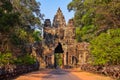 Entrance to ancient Angkor Wat temple at sunrise