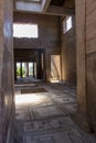 Entrance to antique roman villa in Pompeii, Italy. Ancient stone house with beautiful floor mosaic. Pompeii ruins.