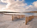 Entrance to a beach through wooden fence. Dunes protection measure. Dog`s bay, county Galway, Ireland. Beautiful scenery Royalty Free Stock Photo