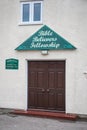 Entrance to Bible Believers Fellowship Church with sign giving service details