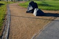 At the entrance to the bike path or the park, a large stone is placed in the middle of the road as a barrier against the car. next