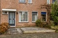 Entrance to a brick house with a gravel terrace