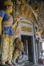 Entrance to buddhist temple decorated with ancient statues Royalty Free Stock Photo