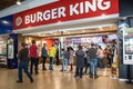 Entrance to Buger King fast food restaurant inside mall shopping centre service station setting with people Royalty Free Stock Photo