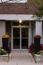 Entrance to building with flowers near the door. Residential house. Apartment building or condo