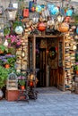 Entrance to the cafe is decorated with potted flowers and vintage things