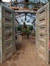 Entrance to the cafe inside the greenhouse at Petersham Nurseries in Richmond, London UK