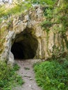 Dark rocky cave entrance Royalty Free Stock Photo