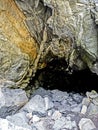 entrance to a cave in an old industrial excavation Royalty Free Stock Photo