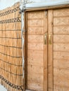 Entrance to a Central Asian gazebo called a Yurt made of yellow dried reeds