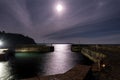 The entrance to Charlestown harbour, Cornwall, by moonlight Royalty Free Stock Photo