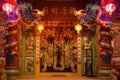 Entrance to the chinese temple guarder by dragons on pillars and samurais on doors