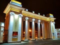 Entrance to the city park. Evening of Kharkiv city. Facade lighting. Tall columns. European cities