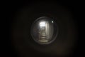 Entrance to corridor with peephole. Spyhole close up.