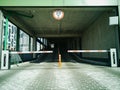 Entrance to the covered multi-level parking for cars with a barrier and video surveillance Royalty Free Stock Photo