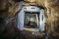 Entrance to dirty flooded abandoned mine tunnel