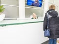 Entrance to Europe 1 recording studio in Paris. Woman waiting at desk. The building houses journalists and programme makers