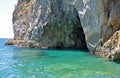 Entrance to the Green grotto with colourful walls and emerald wa