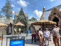 The entrance to the Hagrid`s Magical Creatures Ride at Wizarding World of Harry Potter with people wearing face masks