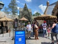 The entrance to the Hagrid`s Magical Creatures Ride at Wizarding World of Harry Potter with people wearing face masks