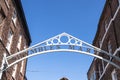 Entrance to the historic Shambles Market showing entrance sign, buildings and blue sky