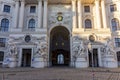 Entrance to Hofburg palace on St. Michael square Michaelerplatz in Vienna, Austria